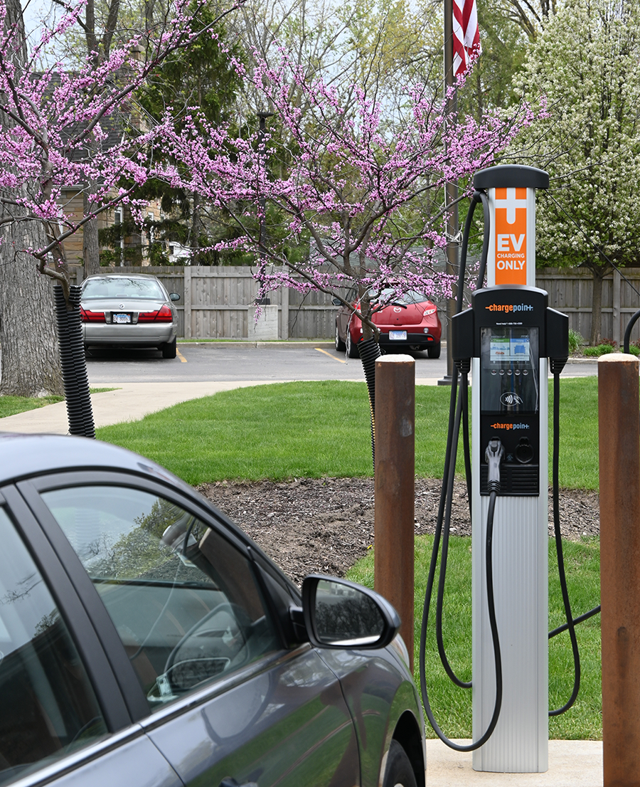 EV charging station with car parked in front
