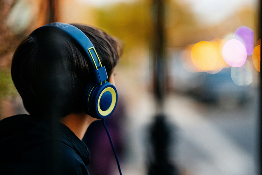 Image of a young boy listening to headphones
