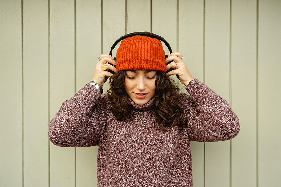 Woman putting headphones on her head