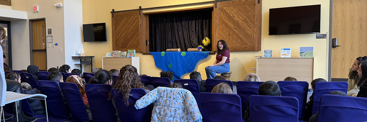 Presenter giving a presentation to young children
