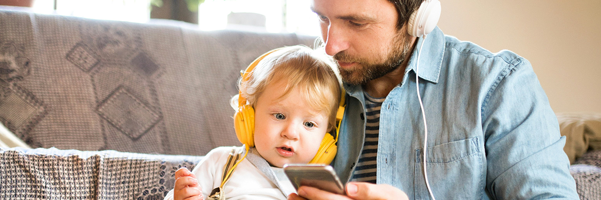 Father and baby son with headphones on