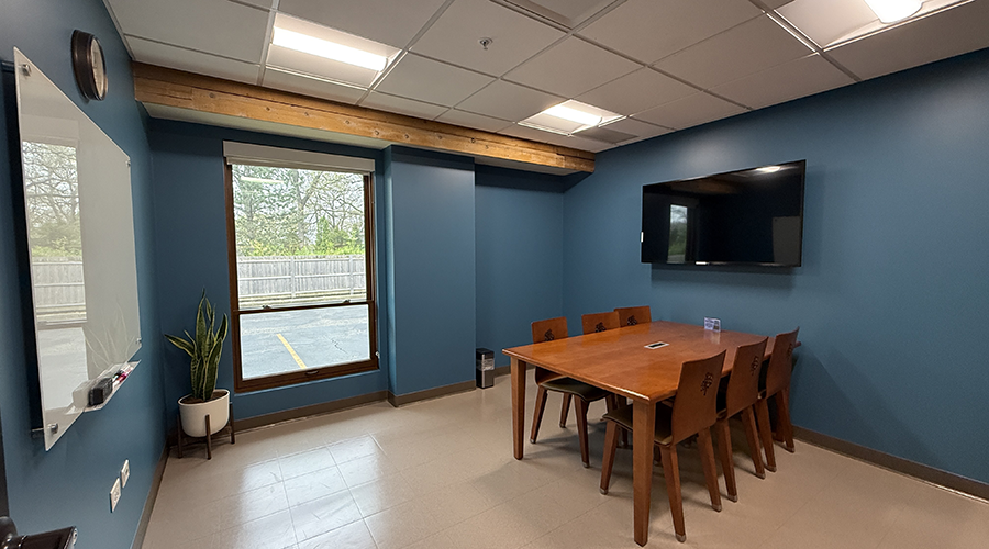 Study Room 3 interior showing a table, six chairs, and a mounted monitor